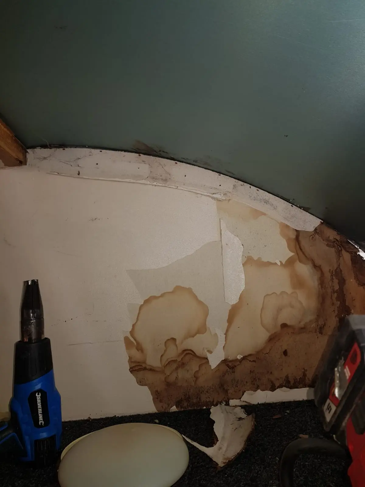 Damp damage spreading along motorhome interior wall