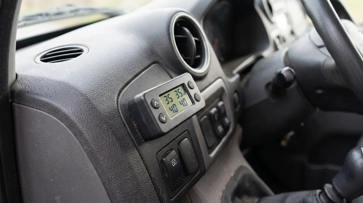 Air suspension pressure controller mounted on a van dashboard
